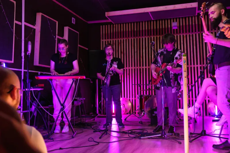 Why 300 Strangers in a Dark Room Beat 30,000 in a Stadium Every Single Time